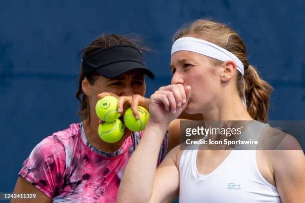 Monica Niculescu and Vivian Heisen talk during their National Bank Open tennis tournament doubles match on August 9 at Sobeys Stadium in Toronto, ON,...