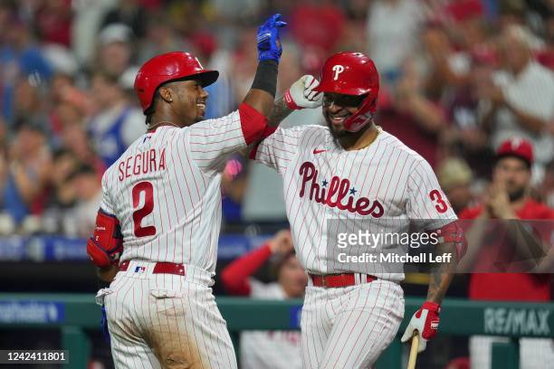 Jean Segura of the Philadelphia Phillies celebrates with Edmundo Sosa after hitting a solo home run in the bottom of the fourth inning against the...