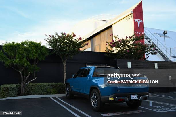 Rivian R1T electric pickup truck sits parked outside a Tesla Inc. Location in Hawthorne, California, on August 9, 2022. Elon Musk has sold nearly $7...