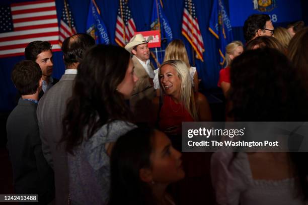 People attend the primary election night event for businessman and Republican candidate for Wisconsin governor Tim Michels at Tuscan Hall Venue &...