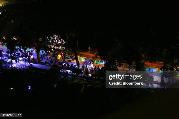 Street vendors use USB-powered LED lights to sell their products during a load-shedding power outage period in Dhaka, Bangladesh, on Tuesday, Aug. 9,...