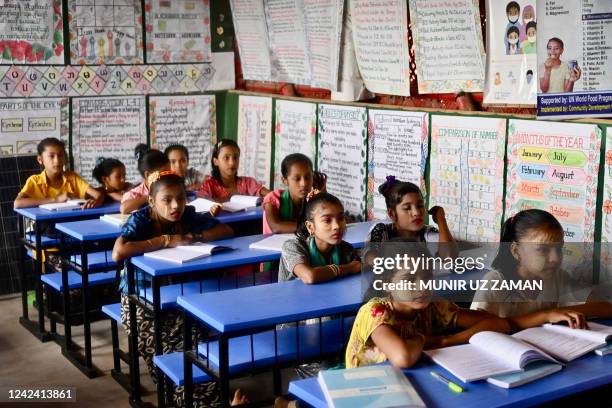 Rohingya refugee children attend a class at a school in Kutupalong refugee camp in Ukhia on August 10, 2022.