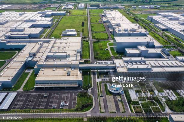 This aerial photo taken on August 8, 2022 shows a factory of German auto manufacturer BMW in Shenyang in China's northeastern Liaoning province. /...