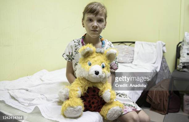 Ukrainian girl 7-year-old Maria Didenko is seen at the refugee camp whose name is "Zatisniyi Kutooch", which means "Peaceful Place" in Dnipro,...