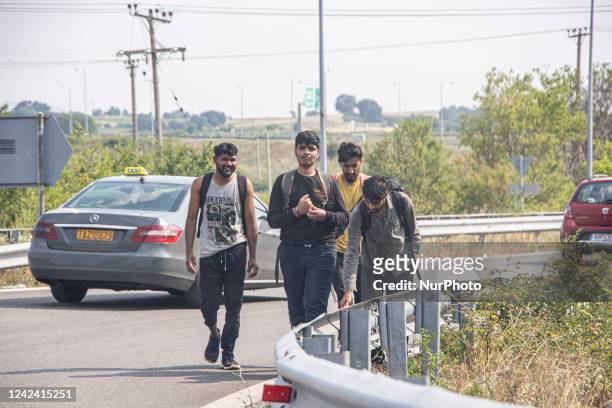 Group of young asylum seekers from Pakistan as seen walking on the road next to the cars near the city of Komotini next to Egnatia highway as they...