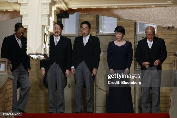 Fumio Kishida, Japan's prime minister, center, with his cabinet members Tetsuo Saito, Japan's land and infrastructure minister, Yoshimasa Hayashi,...