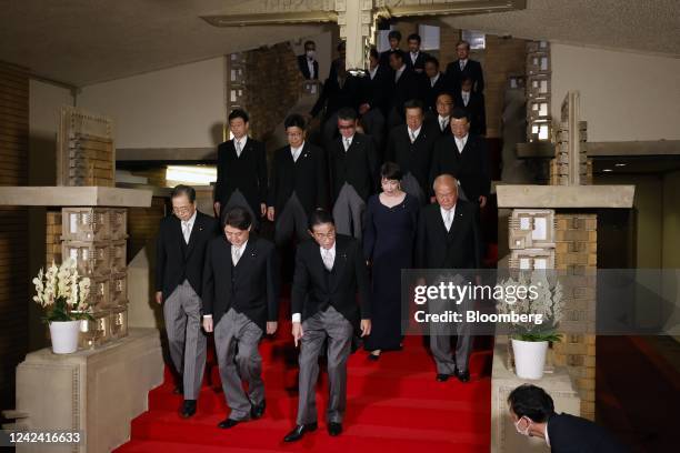 Fumio Kishida, Japan's prime minister, front, arrives with his cabinet members in Tokyo, Japan, on Wednesday, Aug. 10, 2022. Japan's cabinet...