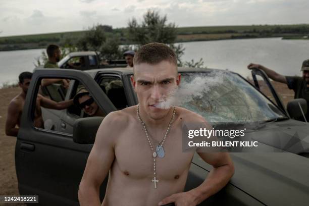 Ukranian soldiers take rest some km away from the frontline in Donbass region on August 10 amid Russian invasion of Ukraine.