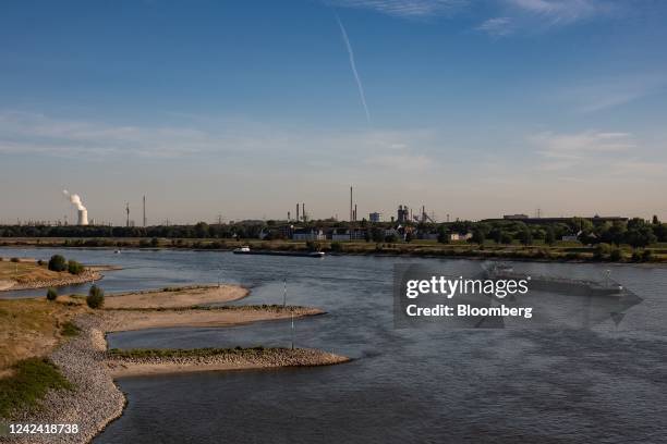 The Jasmar inland motor tanker travels past steel plants while navigating low water levels on the Rhine river in Duisburg, Germany, on Wednesday,...