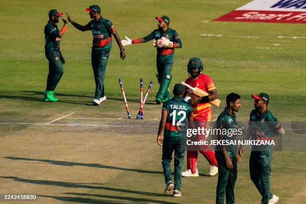 Zimbabwe's Richard Ngarava shakes hands with Bangladesh players after Bangladesh's victory during the third one-day international cricket match...