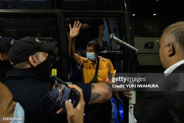 Bus carrying migrants from Texas arrives at Port Authority Bus Terminal on August 10, 2022 in New York. - Texas has sent thousands of migrants from...