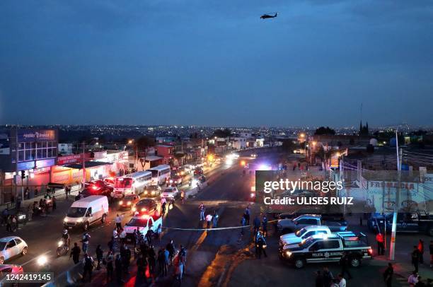 Aerial view showing members of the State Prosecutor's Office and Municipal Police guarding the area where gang members set a bus on fire blocking a...