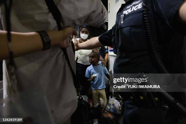 Bus carrying migrants from Texas arrives at Port Authority Bus Terminal on August 10, 2022 in New York. - Texas has sent thousands of migrants from...