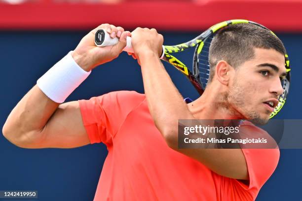 Carlos Alcaraz of Spain hits a return against Tommy Paul of the United States during Day 5 of the National Bank Open at Stade IGA on August 10, 2022...
