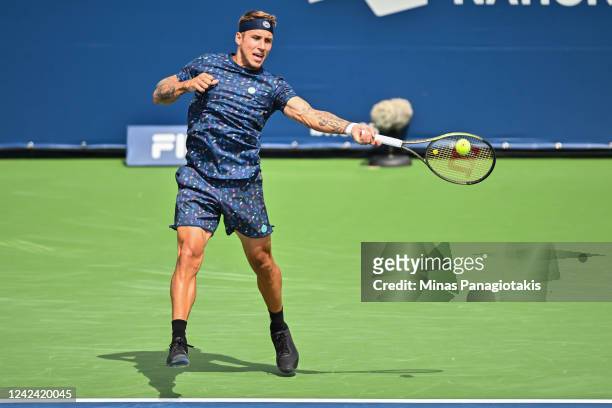 Alex Molcan of Slovakia hits a return against Casper Ruud of Norway during Day 5 of the National Bank Open at Stade IGA on August 10, 2022 in...
