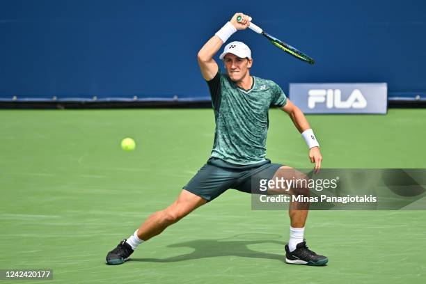 Casper Ruud of Norway hits a return against Alex Molcan of Slovakia during Day 5 of the National Bank Open at Stade IGA on August 10, 2022 in...