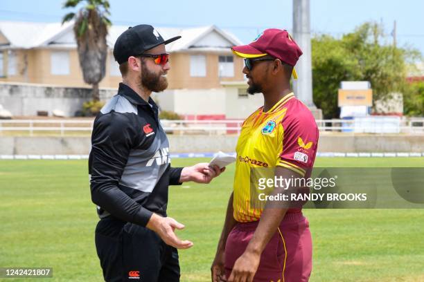 Kane Williamson , of New Zealand, and Nicholas Pooran , of West Indies, speak before the coin toss during the first T20i match between West Indies...