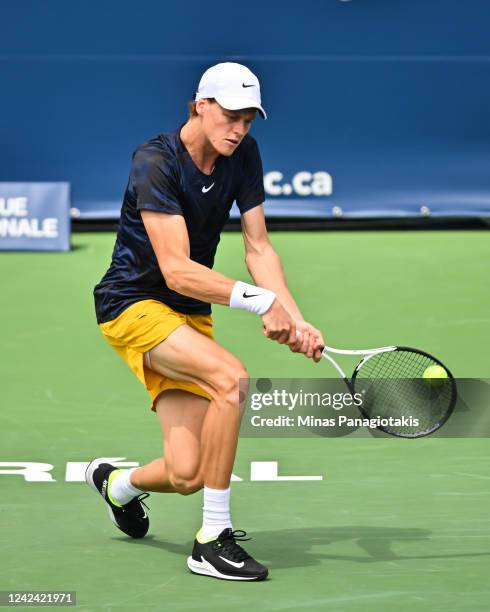 Jannik Sinner of Italy hits a return against Adrian Mannarino of France during Day 5 of the National Bank Open at Stade IGA on August 10, 2022 in...