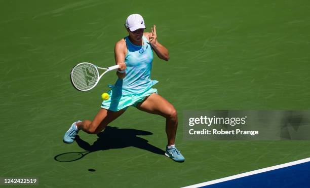 Iga Swiatek of Poland hits a shot against Ajla Tomljanovic of Australia during her second round match on Day 5 of the National Bank Open, part of the...