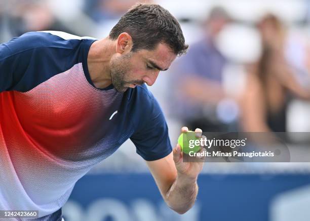 Marin Cilic of Croatia prepares to serve against Karen Khachanov during Day 5 of the National Bank Open at Stade IGA on August 10, 2022 in Montreal,...