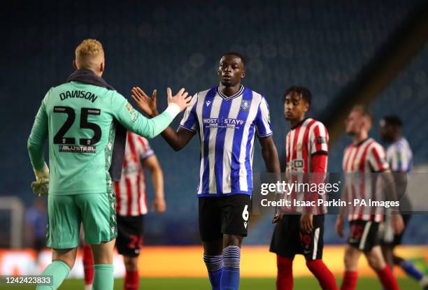Sheffield Wednesday goalkeeper Cameron Dawson greets team-mate Dominic Iorfa following the Carabao Cup, first round match at Hillsborough, Sheffield....