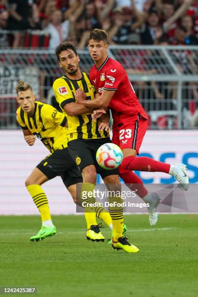 Nico Schlotterbeck of Borussia Dortmund, Mats Hummels of Borussia Dortmund and Adam Hlozek of Bayer 04 Leverkusen battle for the Ball during the...