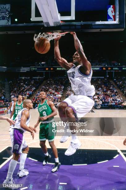 Michael Stewart of the Sacramento Kings dunks the ball during a game against the Boston Celtics on February 16,1999 at the Arco Arena in Sacramento,...