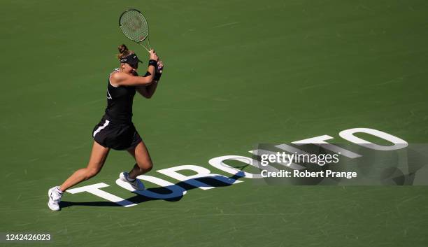 Beatriz Haddad Maia of Brazil hits a shot against Leylah Fernandez of Canada during her second round match on Day 5 of the National Bank Open, part...