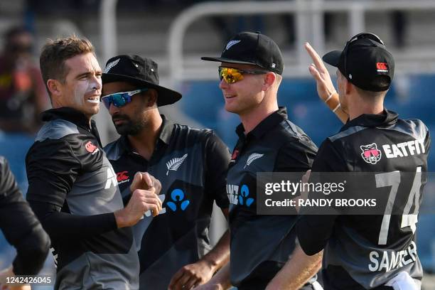 Tim Southee , Ish Sodhi and James Neesham of New Zealand celebrate the dismissal of Kyle Mayers of West Indies during the first T20i match between...