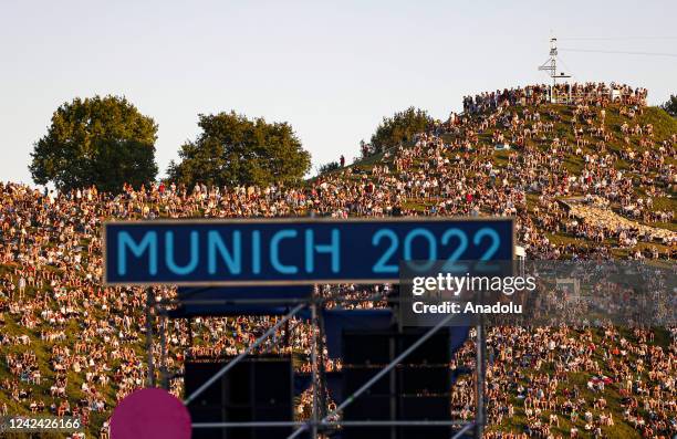 People gather to watch concerts and dance shows during the opening ceremony of the European Championships Munich 2022 at Olympiapark on August 10,...