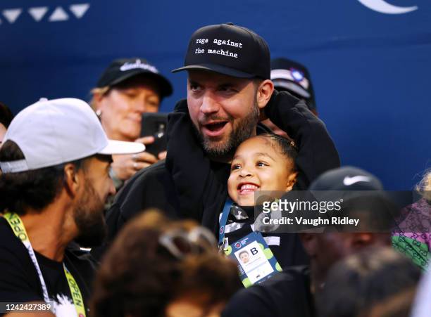 Alexis Ohanian and Alexis Olympia Ohanian Jr., husband and daughter of Serena Williams of the United States, watch as Serena plays Belinda Bencic of...