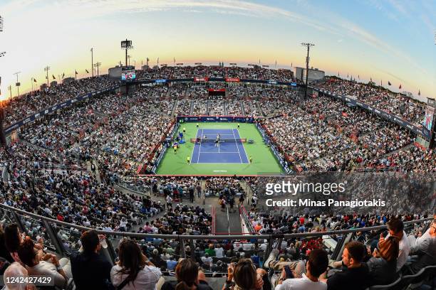 Spectators look on as Yoshihito Nishioka of Japan and Felix Auger-Aliassime of Canada make their way to centre court prior to their match during Day...