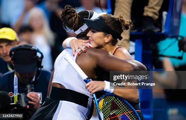 Serena Williams of the United States and Belinda Bencic of Switzerland embrace at the net after their second round match on Day 5 of the National...