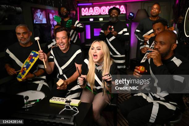 Episode 1697 -- Pictured: Host Jimmy Fallon, singer Madonna, and The Roots during Classroom Instruments on Wednesday, August 10, 2022 --