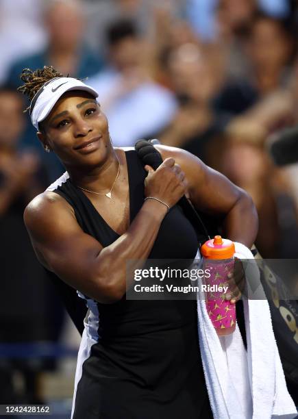 Serena Williams of the United States smiles as she leave the court after losing to Belinda Bencic of Switzerland during the National Bank Open, part...