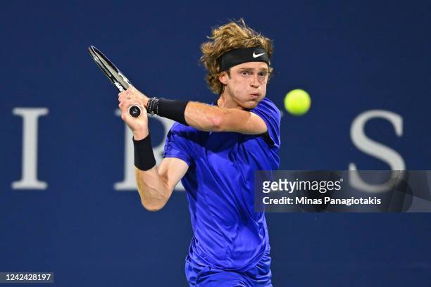 Andrey Rublev of Russia hits a return against Daniel Evans of Great Britain during Day 5 of the National Bank Open at Stade IGA on August 10, 2022 in...