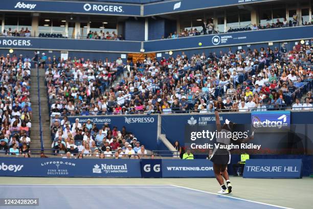 Serena Williams of the United States serves against Belinda Bencic of Switzerland during the National Bank Open, part of the Hologic WTA Tour, at...