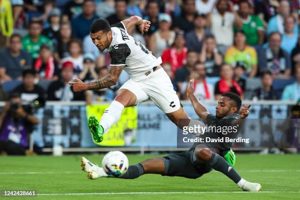 Juan Escobar of the Liga MX All-Stars attempts a shot against Diego Palacios of the MLS All-Stars in the first half of the MLS All-Star game at...