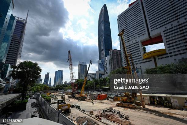 This photo taken on July 12 shows workers at the construction site of city metro in Shenzhen, in China's southern Guangdong province.
