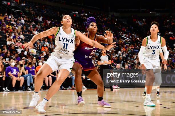 Natalie Achonwa of the Minnesota Lynx plays defense on Reshanda Gray of the Phoenix Mercury during the game on August 10, 2022 at Footprint Center in...