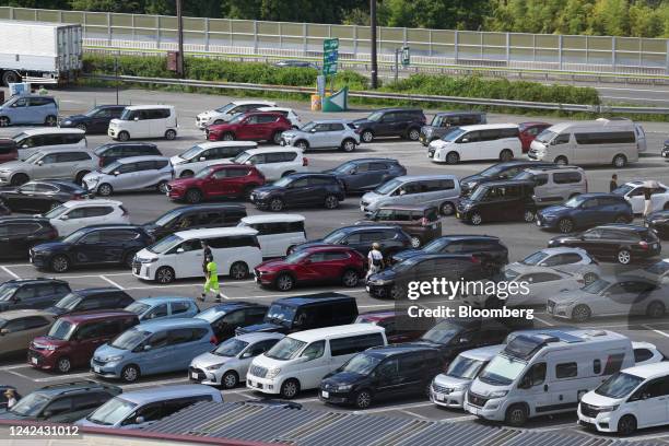 People walk in the Dangozaka service area on the Chuo Expressway in Uenohara, Yamanashi Prefecture, Japan, on Thursday, Aug. 11, 2022. The Obon...