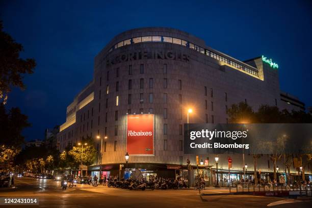 An illuminated El Corte Ingles SA department store, ahead of the start of new rules requiring businesses to turn off lighting at night, in Barcelona,...