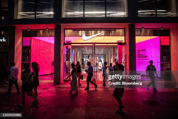 An illuminated Nike Inc. Store, ahead of the start of new rules requiring businesses to turn off lighting at night, in Barcelona, Spain, on...