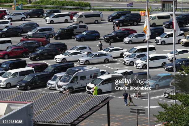 People walk in the Dangozaka service area on the Chuo Expressway in Uenohara, Yamanashi Prefecture, Japan, on Thursday, Aug. 11, 2022. The Obon...