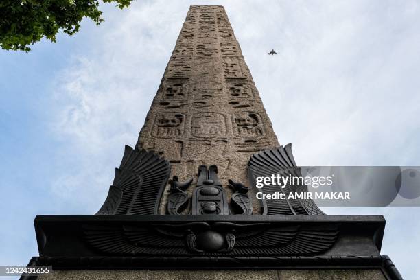 Seagull flies past the ancient Egyptian Obelisk of Thutmose III , known as "Cleopatra's Needle", along the Thames river embankment in London on July...