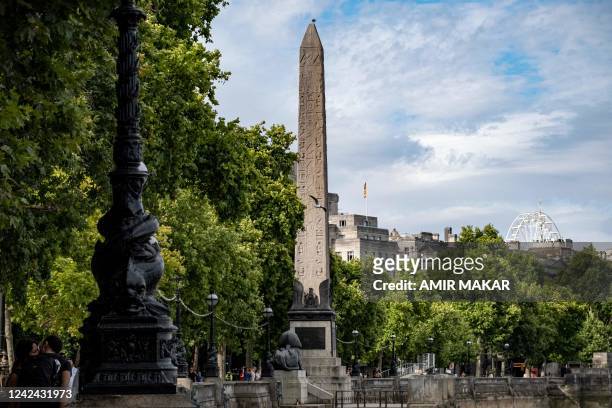 Seagull flies past the ancient Egyptian Obelisk of Thutmose III , known as "Cleopatra's Needle", along the Thames river embankment in London on July...
