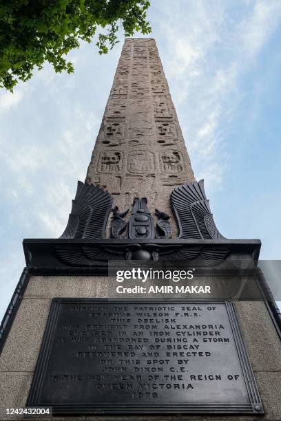 This picture taken on July 23, 2022 shows a view of the base and one of the plaques detailing the transportation process beneath the ancient Egyptian...