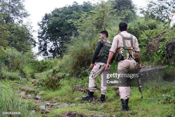 Security personnel patrol near an army camp after an encounter with suspected rebels at Darhal area in Rajouri on August 11, 2022 - Suspected rebels...