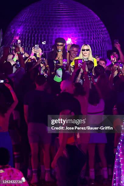 Nile Rodgers and Madonna are seen at The DiscOasis at Wollman Rink in Manhattan's Central Park on August 10, 2022 in New York City.