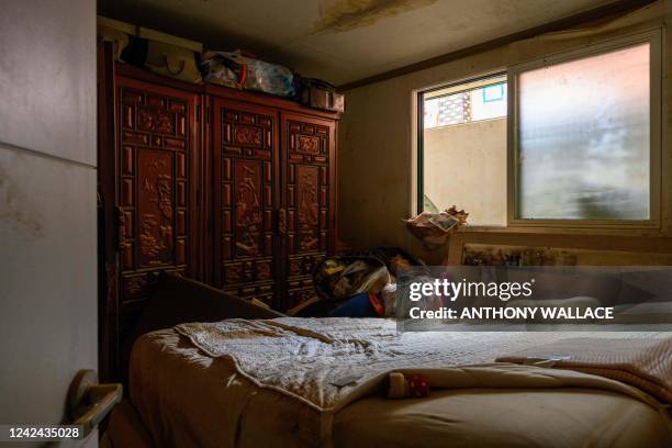 Bedroom is seen in a basement flat known as "banjiha" where three tenants, including a disabled woman and a teenager, died after they became trapped...